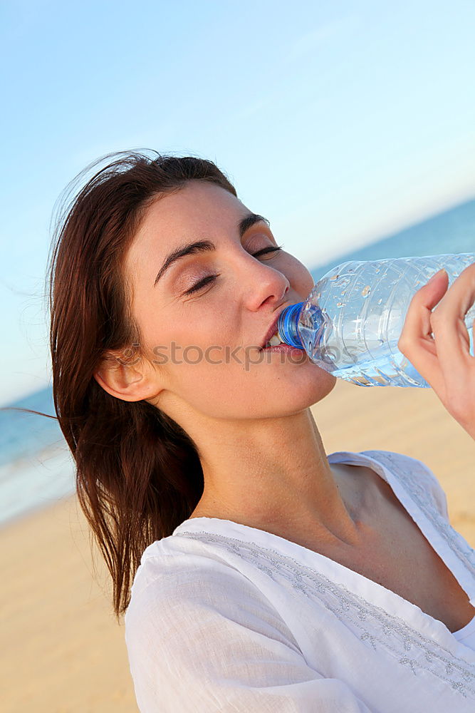 Similar – Fit sporty woman drinking water from a bottle