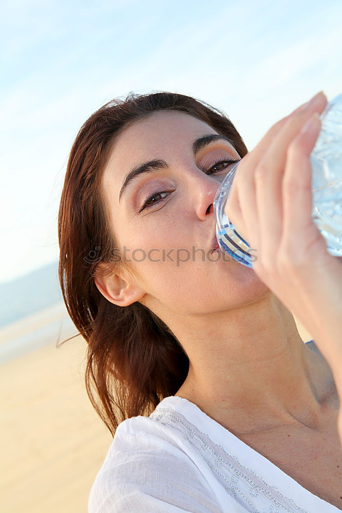 Similar – Fit sporty woman drinking water from a bottle