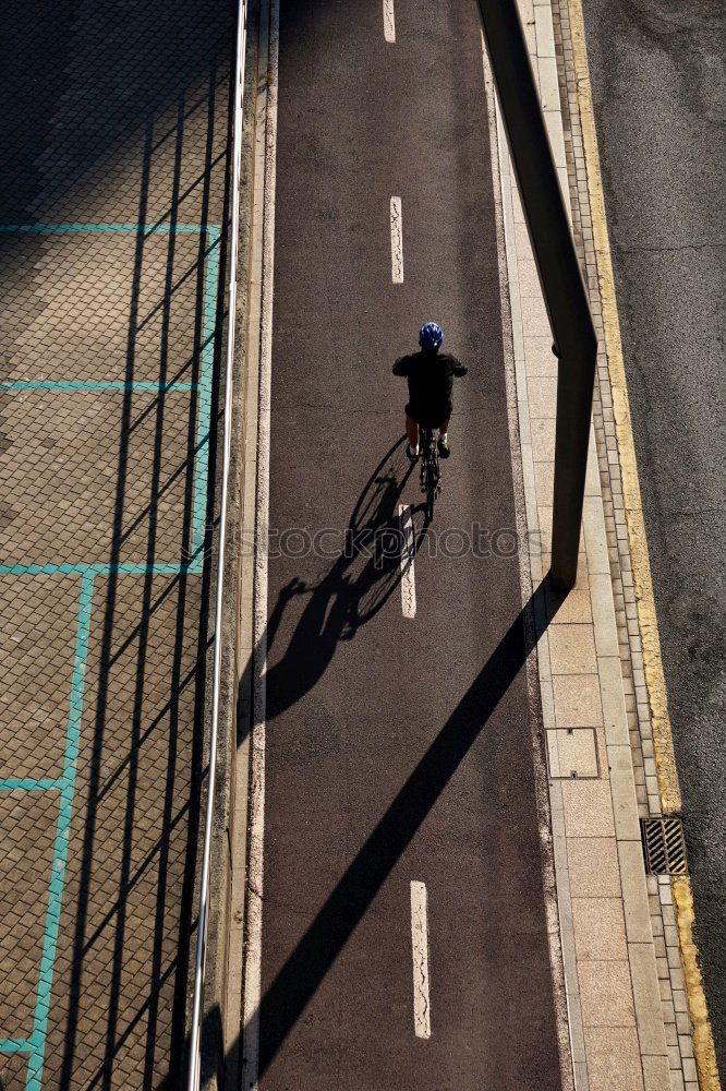 Similar – Cyclist on cobblestone pavement