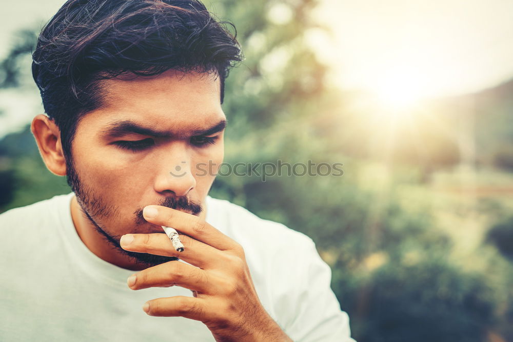 Similar – Image, Stock Photo Confident attractive mulatto man smoking a cigarrette