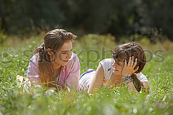 Similar – Image, Stock Photo Boy and girl picking up garbage from ground