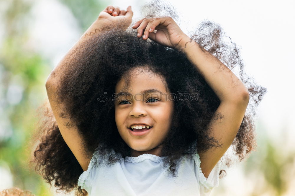 Similar – Young black woman, afro hairstyle, smiling.