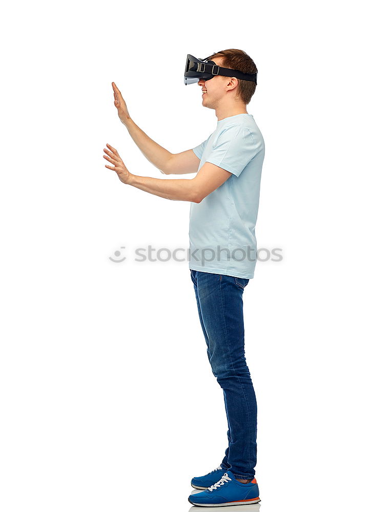 Similar – Foto Bild Ein Mann, der sich eine Virtual-Reality-Brille ansieht.