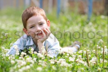 Similar – Image, Stock Photo smiling child sitting in field