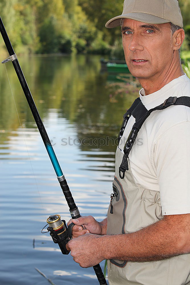 Similar – Fisherman caught a fish