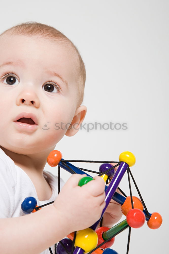 Similar – Baby in a bed in frame of heart shape. Out of focus baby