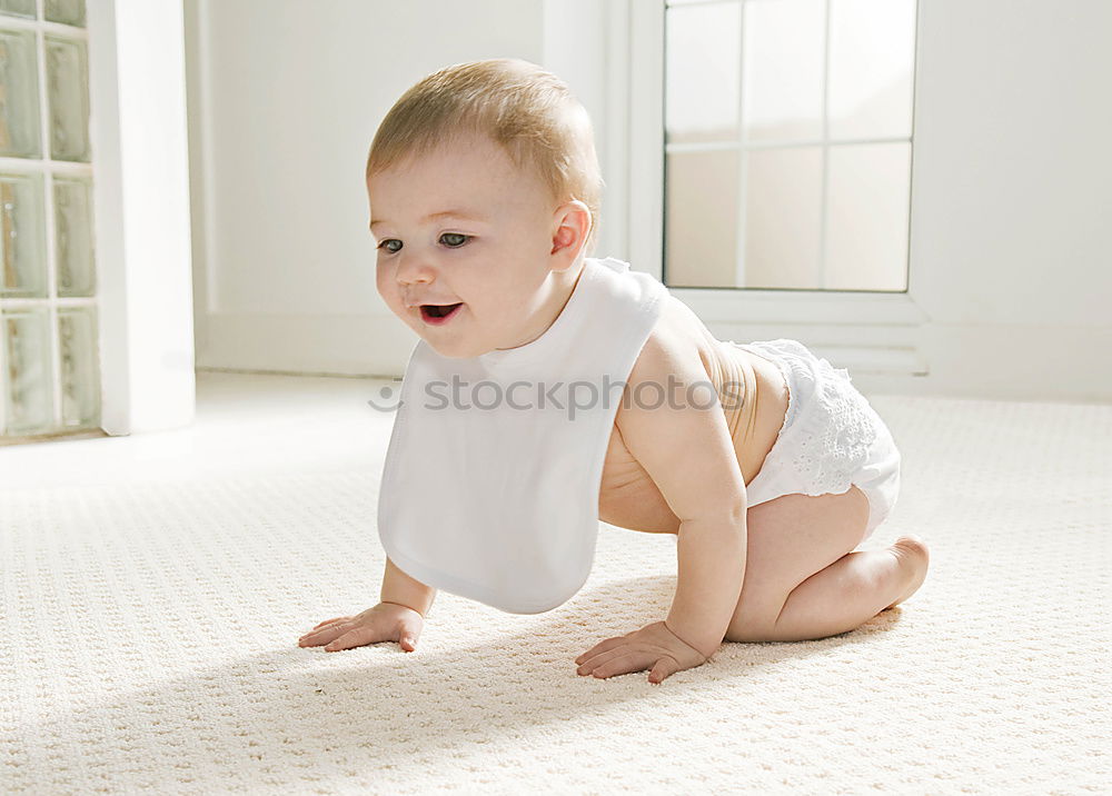 Similar – Happy baby girl, four months old, on the bed with pacifier.