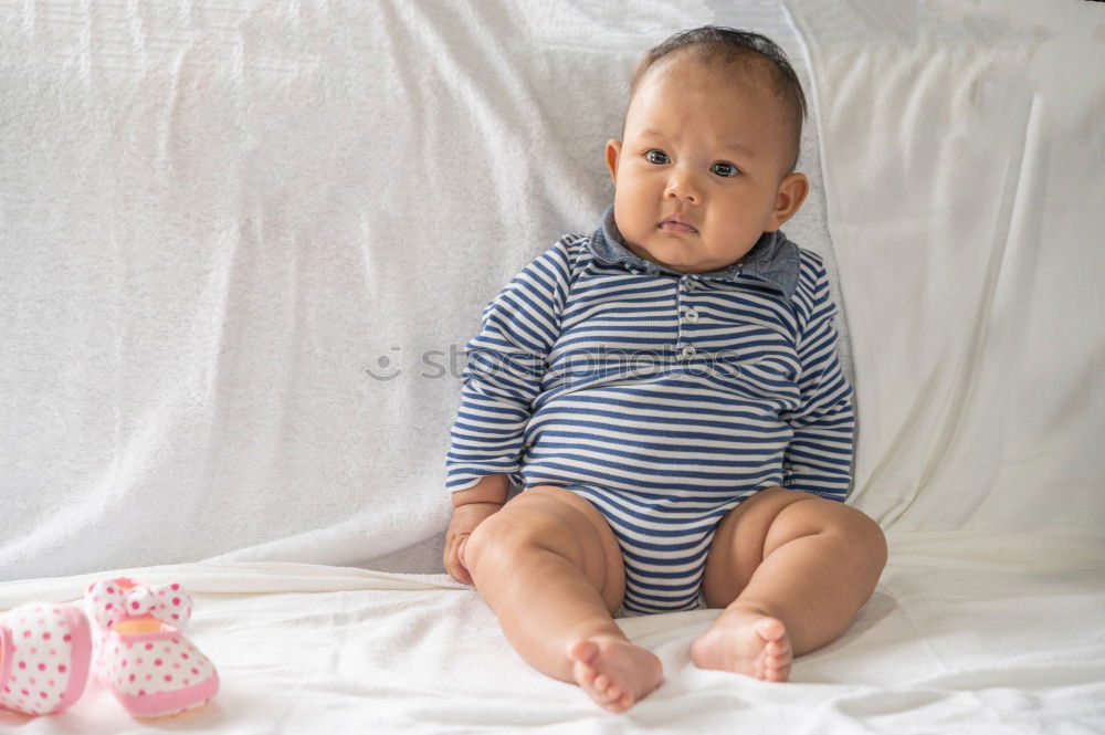 Cute Baby Girl Lying in the Crib