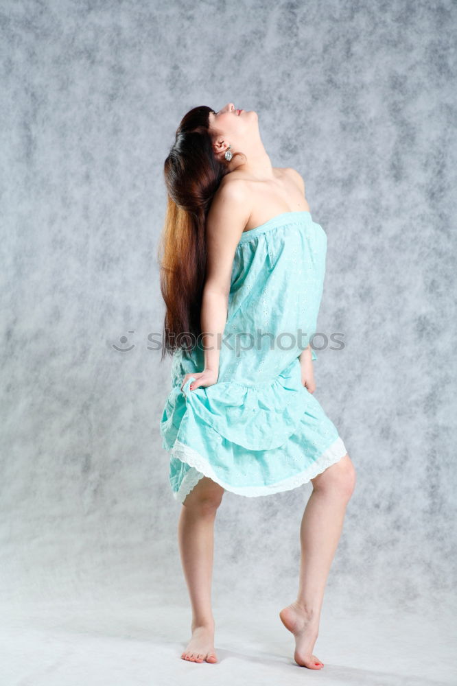 Image, Stock Photo Young, slim, athletic woman stands barefoot with hotpants in the room and looks at the ceiling with laughter