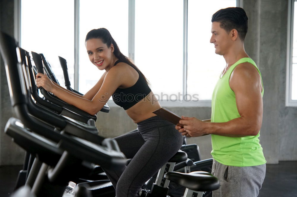 Similar – Man and woman personal trainers in the gym.