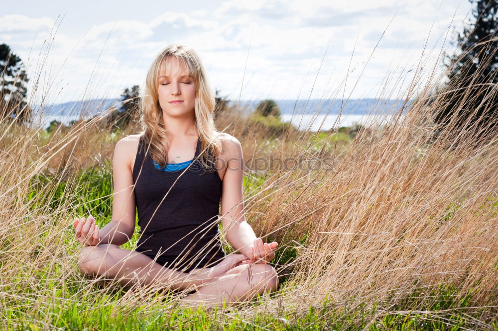 Young woman doing yoga in nature.