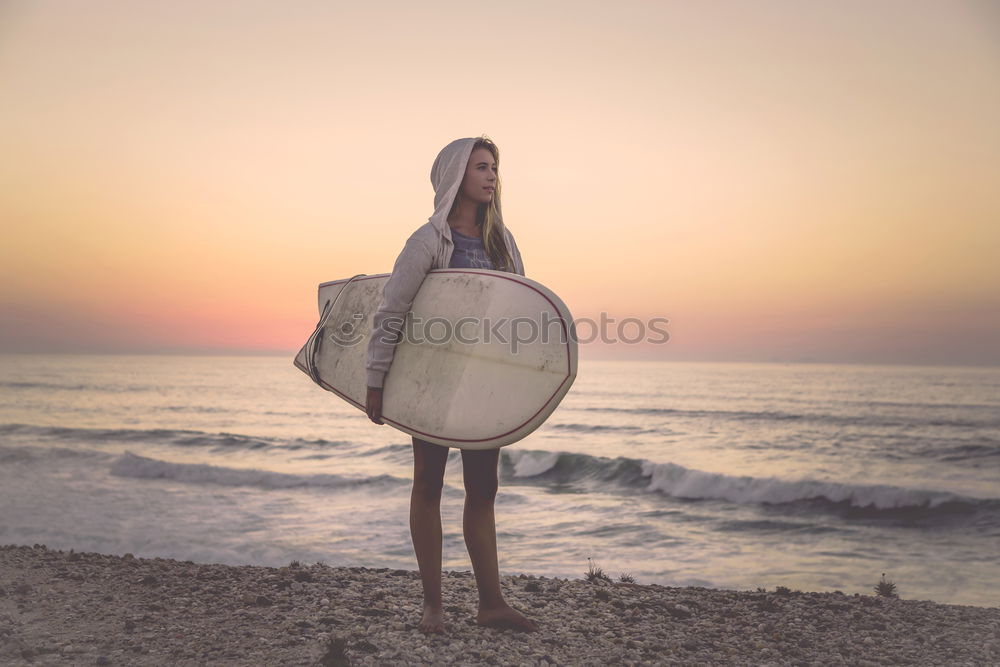 Similar – Image, Stock Photo Young female adult with surfboard at beach
