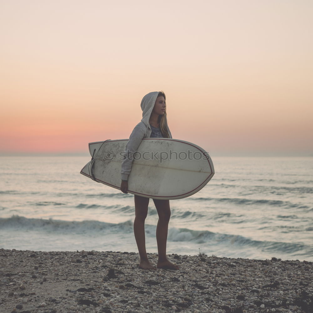 Similar – Image, Stock Photo Two happy girlfriends having fun at the beach with surfboards