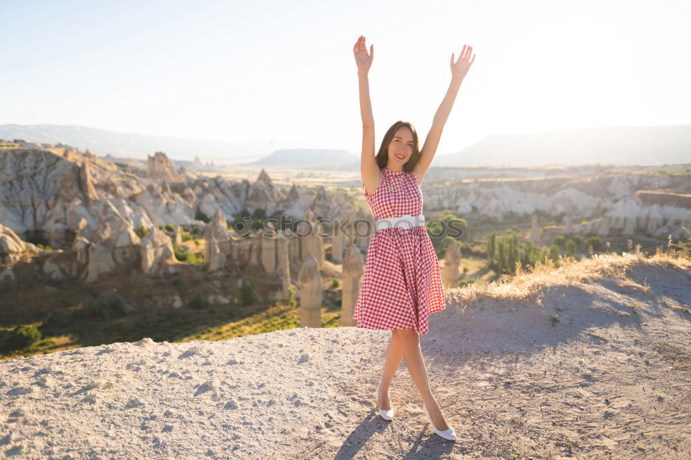 Similar – Stylish woman on picturesque landscape