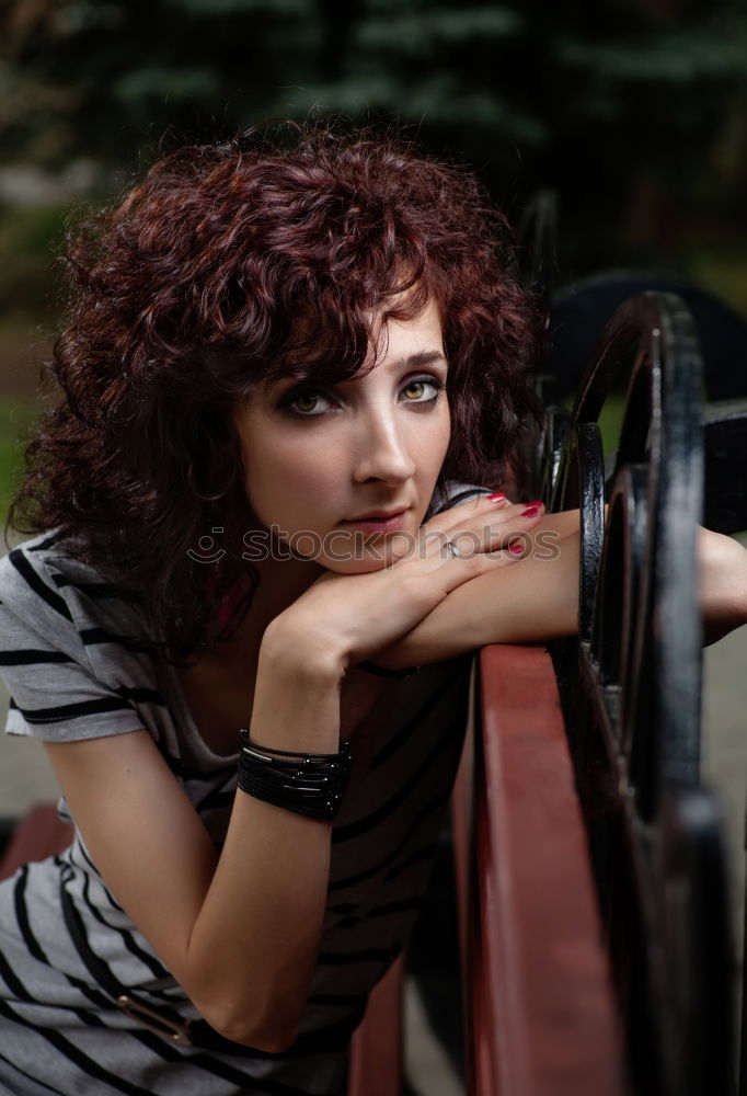 Similar – Portrait of a mature woman sitting on the chair posing thoughtful