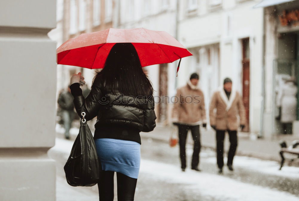 Similar – Image, Stock Photo Little girl holding big umbrella walking in a downtown on rainy gloomy autumn day