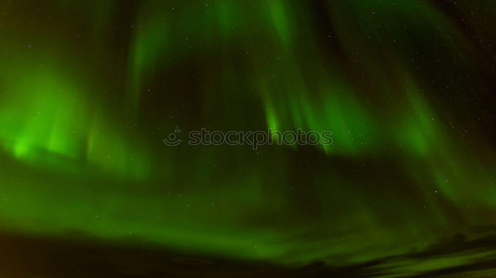 Similar – Image, Stock Photo Green aurora before starry sky and mountain silhouette, Lofoten