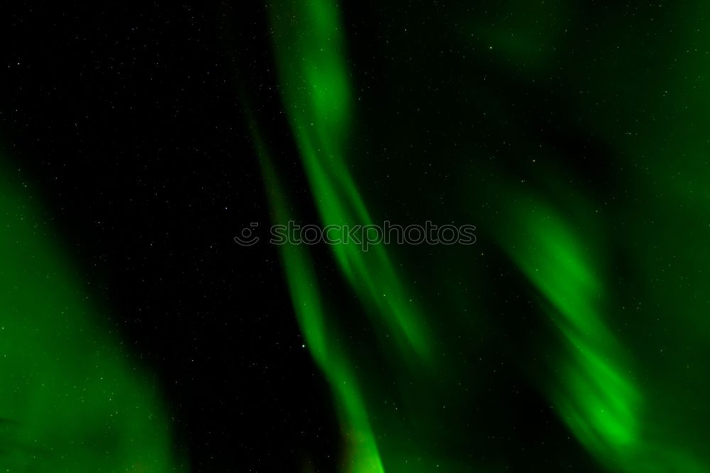 Similar – Image, Stock Photo Green aurora before starry sky and mountain silhouette, Lofoten