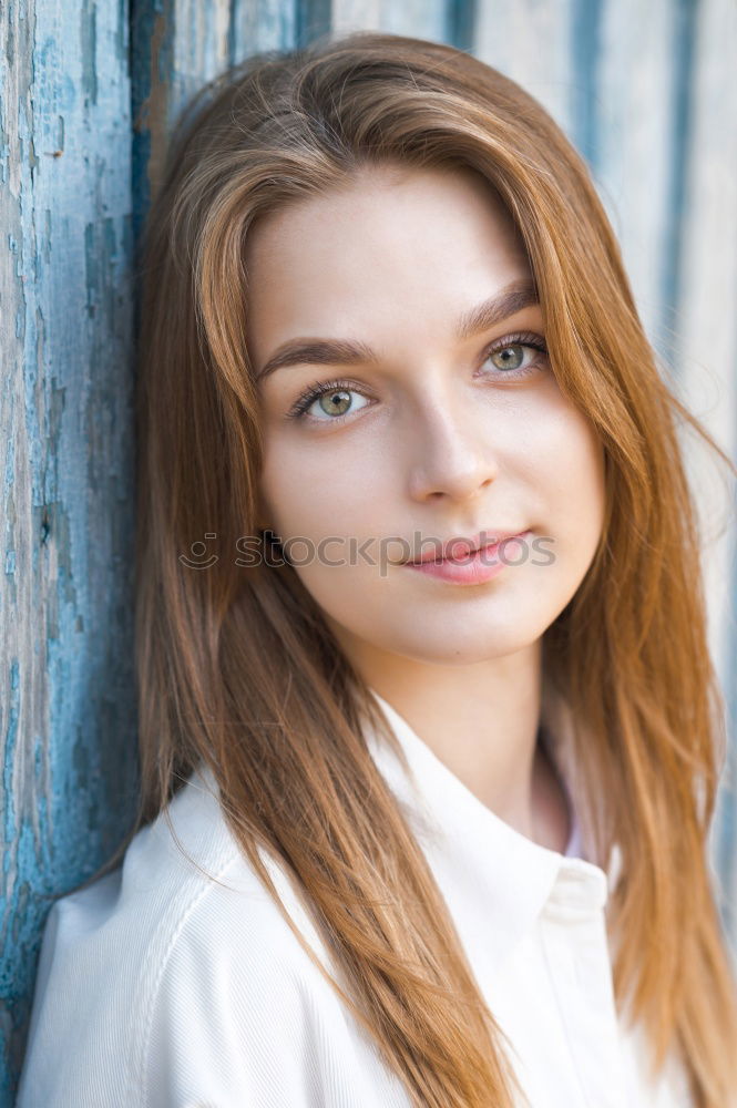 Similar – Portrait of a young teenager girl standing looking throughout the window