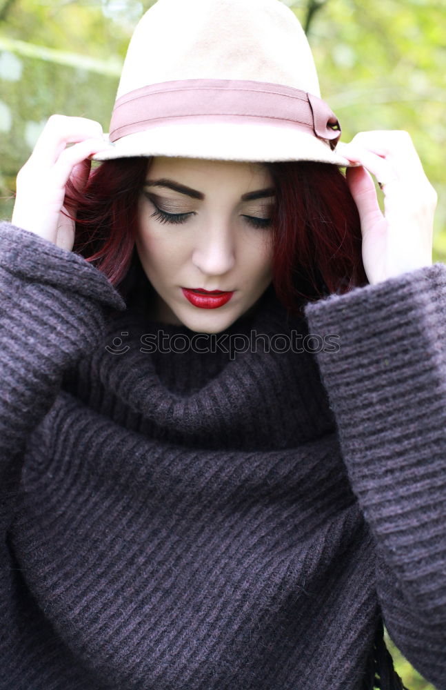 Similar – Young woman sitting on the street