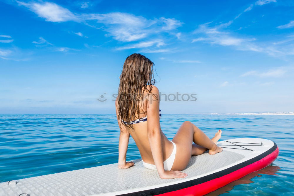 Similar – Image, Stock Photo Surfer girl on green coral reef