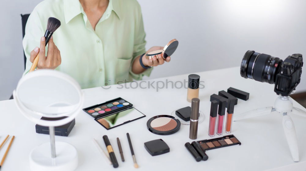 Similar – Young gender fluid person applying makeup at home