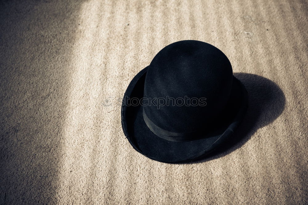 Similar – Shadow of a woman with hat on a wall