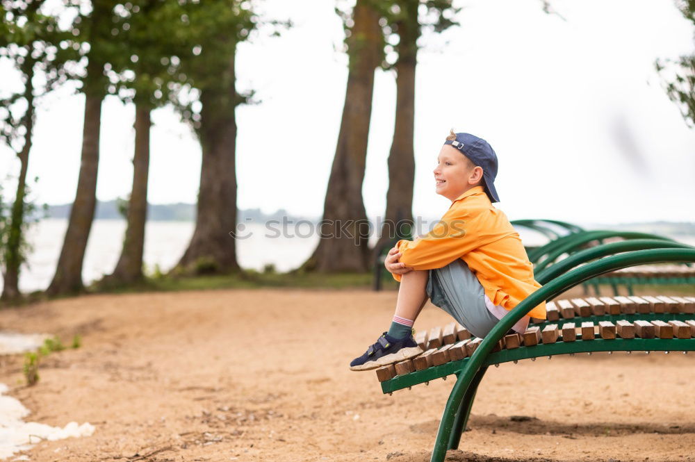 Similar – Image, Stock Photo Tourist sits on a bench on the beach