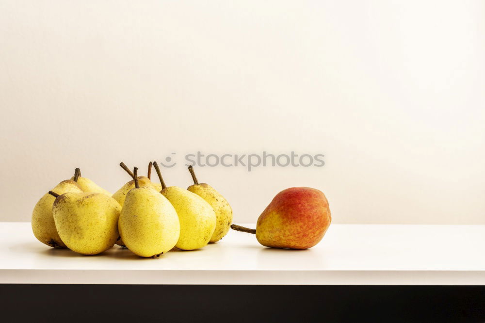 Two lemons in the sunlight on a windowsill