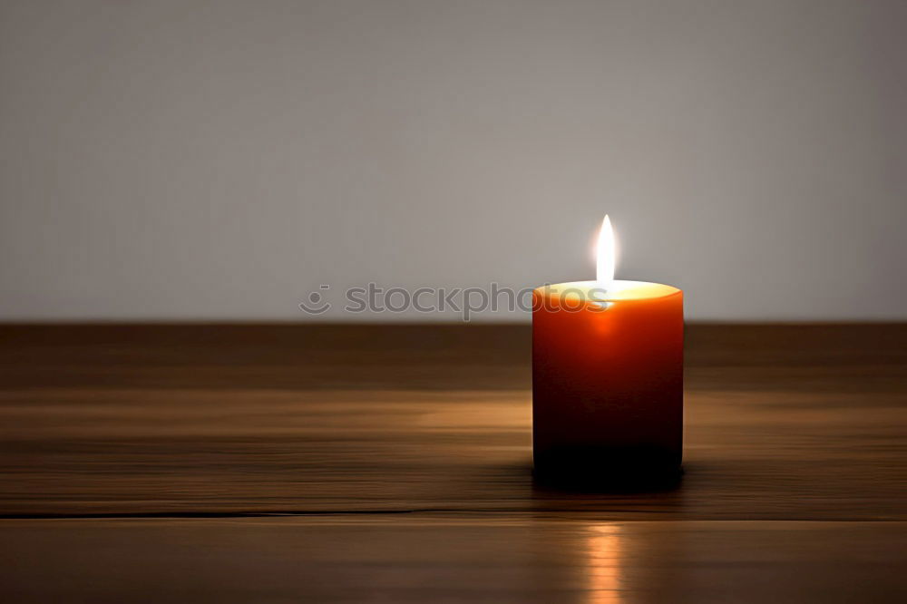 Similar – A single red burning candle held by a girl