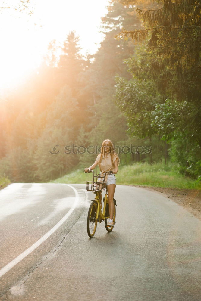 Similar – Image, Stock Photo Racing cyclist in sportswear rides his bike on an Italian country road