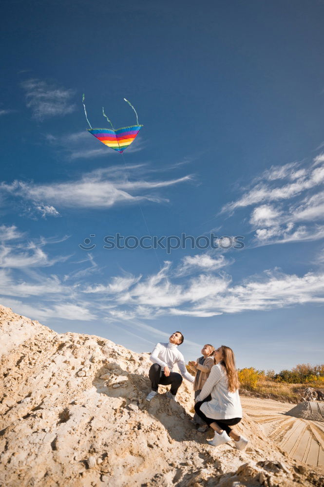 Similar – Image, Stock Photo Excited women lying on cliff