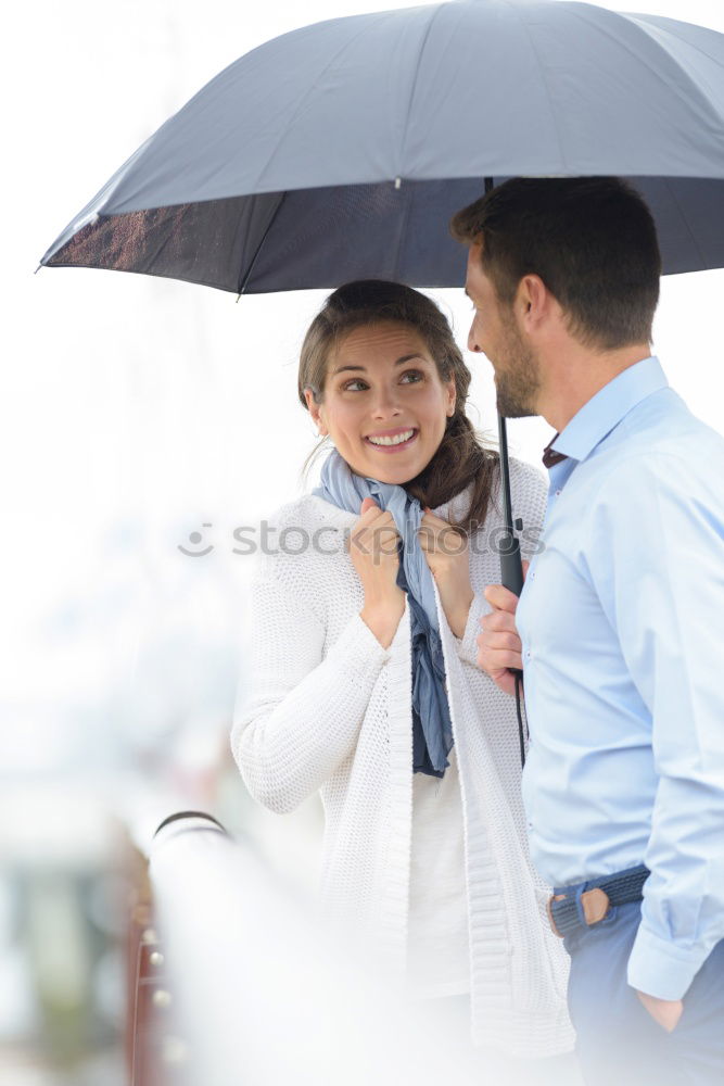 Friends who play in the street with rain. Interracial relationsh