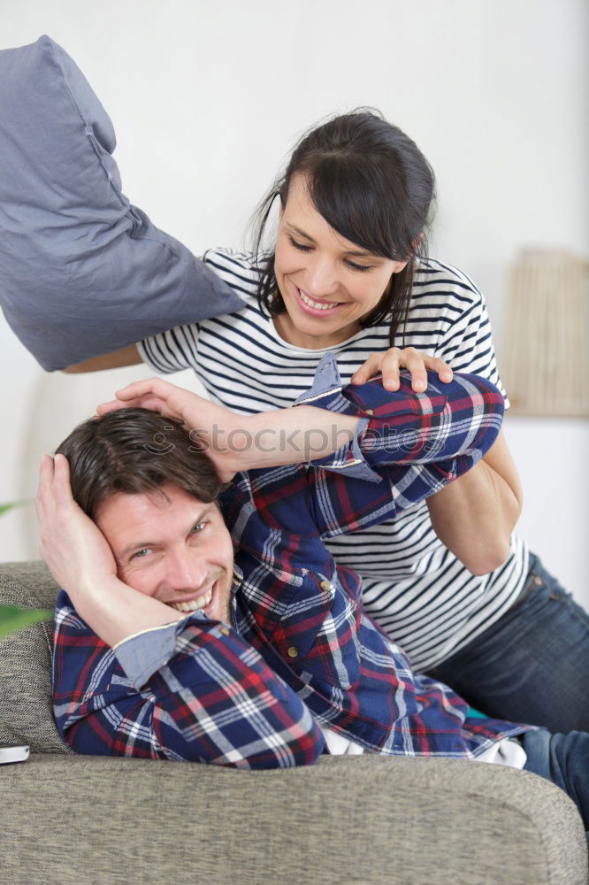 Similar – Image, Stock Photo Happy man listening and touching his pregnant wife tummy on the sofa at home