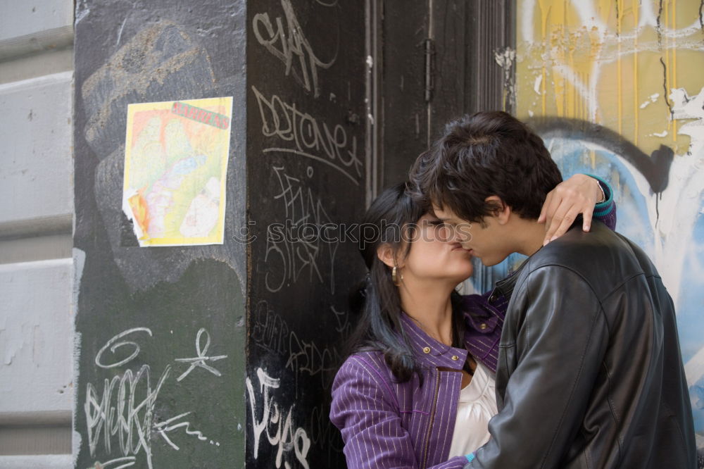 Similar – Portrait of beautiful couple in casual wear hugging in the street