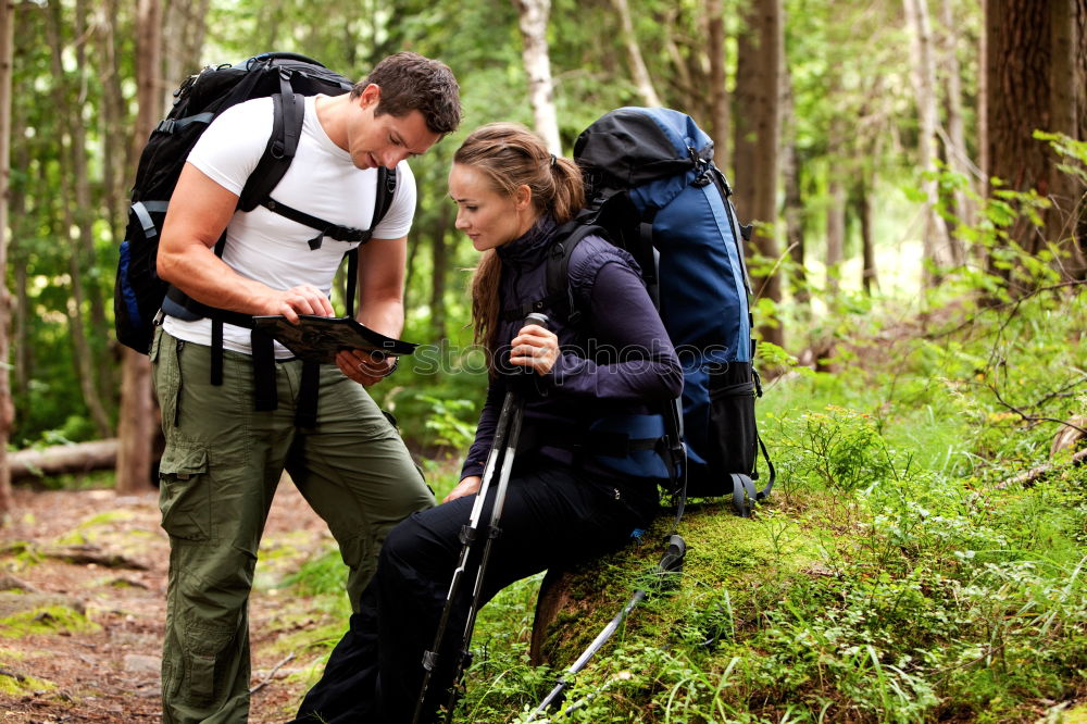 Similar – Hiker closing his partner’s backpack