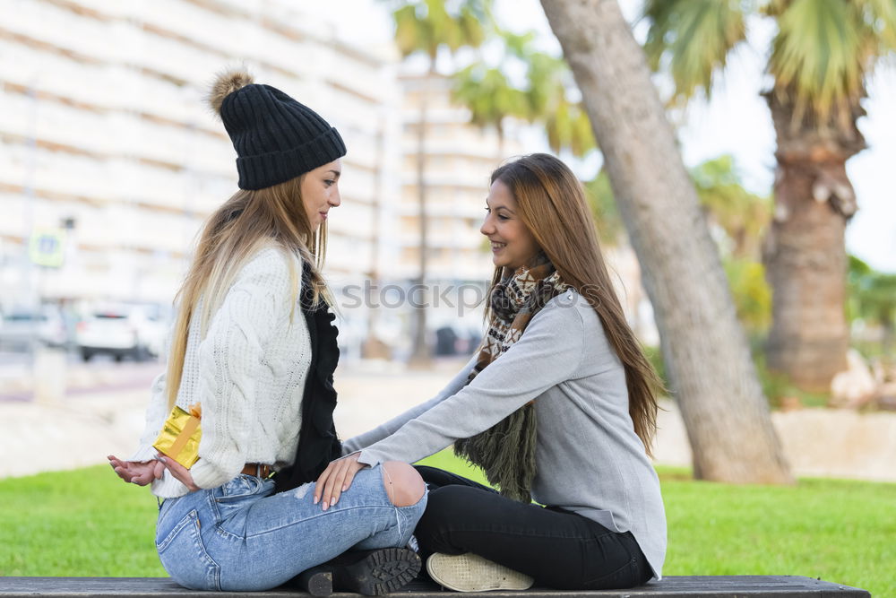 Similar – Two young women talking and laughing on urban steps