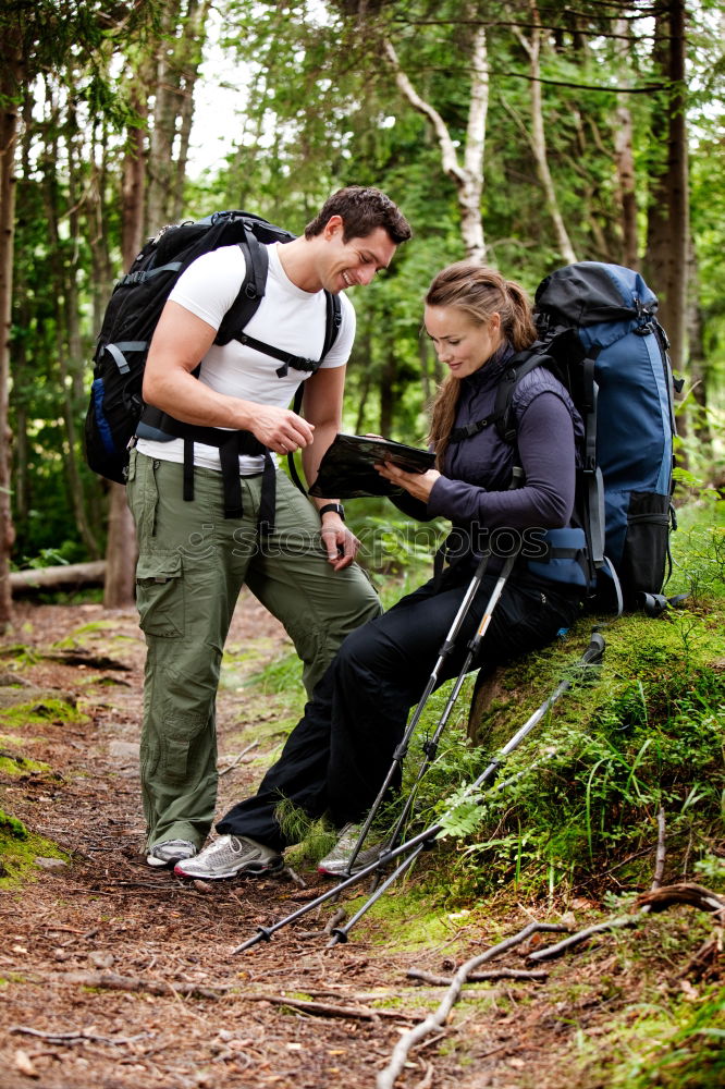 Similar – Hiker closing his partner’s backpack