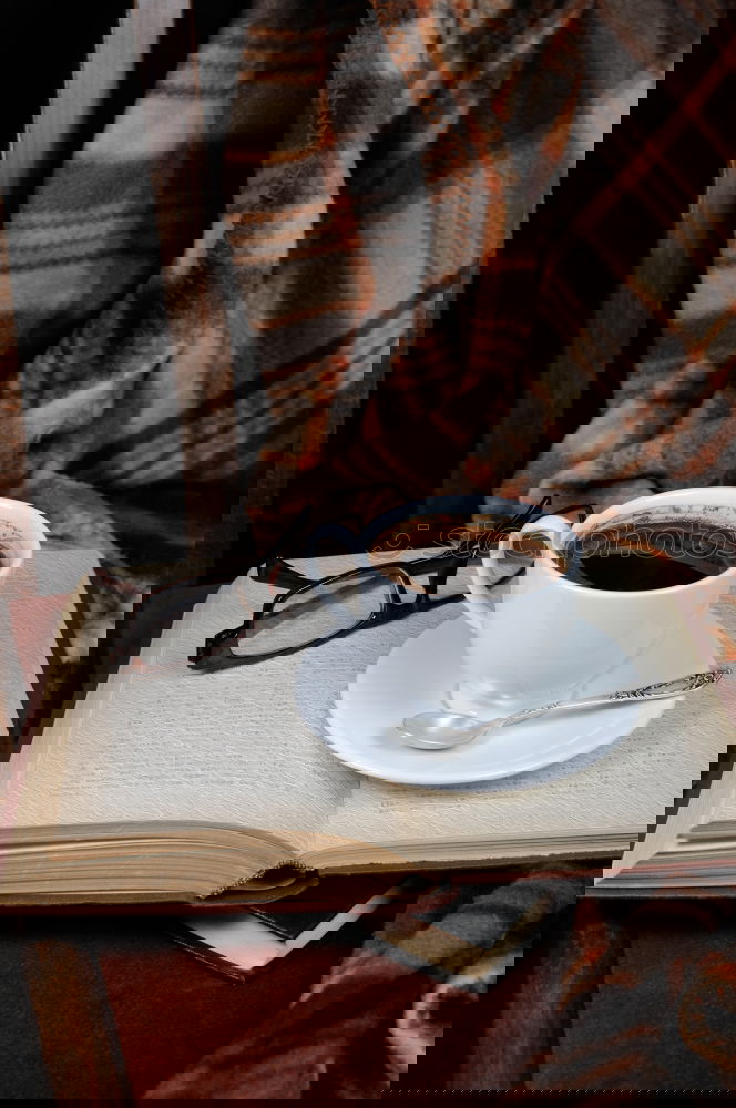 Similar – Image, Stock Photo A cup of coffee on a leather couch