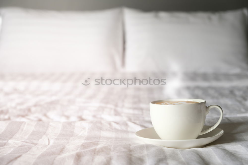 Similar – Image, Stock Photo Cup of coffee and spoon on wooden tray in bed on white sheets