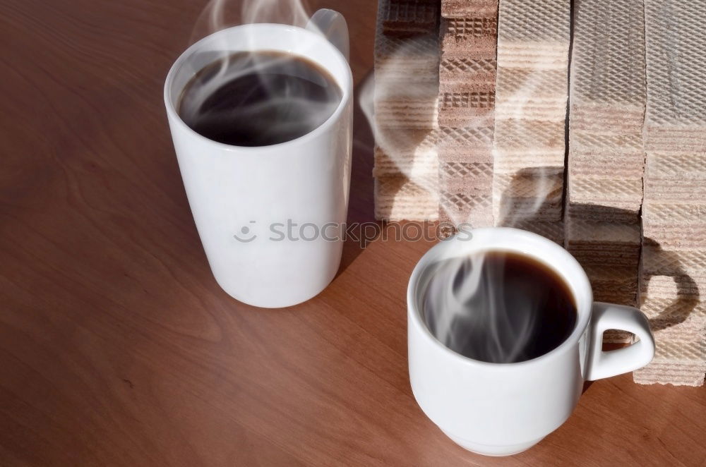 Similar – Hands with coffee cups on table in a urban cafe.