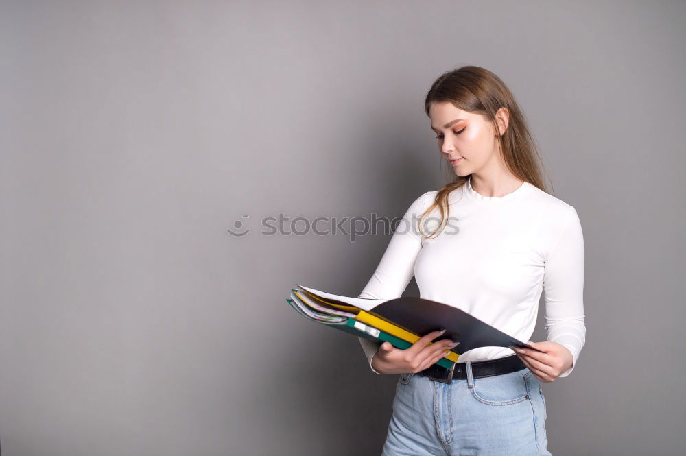 Similar – Young woman sitting on floor with notepad