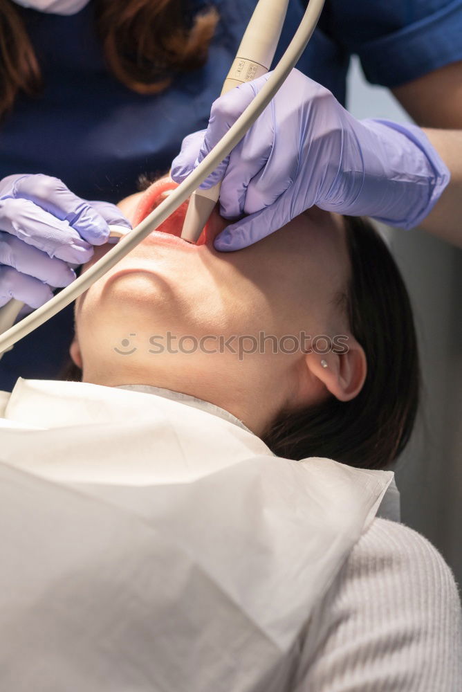 Similar – Image, Stock Photo A fragment of a dental room with a kid, lying on a dental chair, and a part of his doctors figure