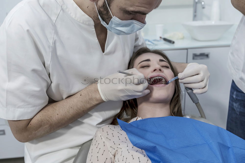 Similar – Image, Stock Photo A fragment of a dental room with a kid, lying on a dental chair, and a part of his doctors figure