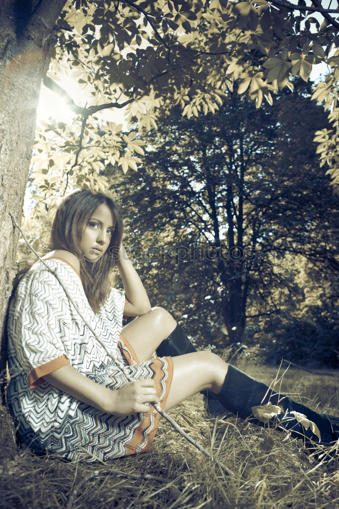 Similar – Image, Stock Photo young woman with turquoise hair sits barefoot leaning against tree in beach forest and looks at camera