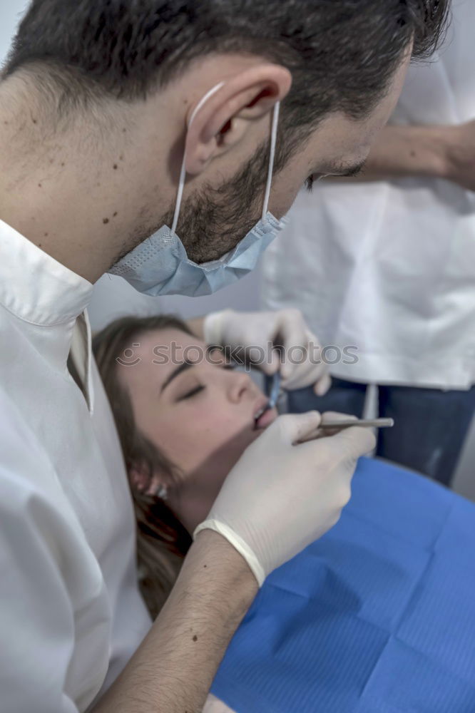 Similar – Image, Stock Photo A fragment of a dental room with a kid, lying on a dental chair, and a part of his doctors figure