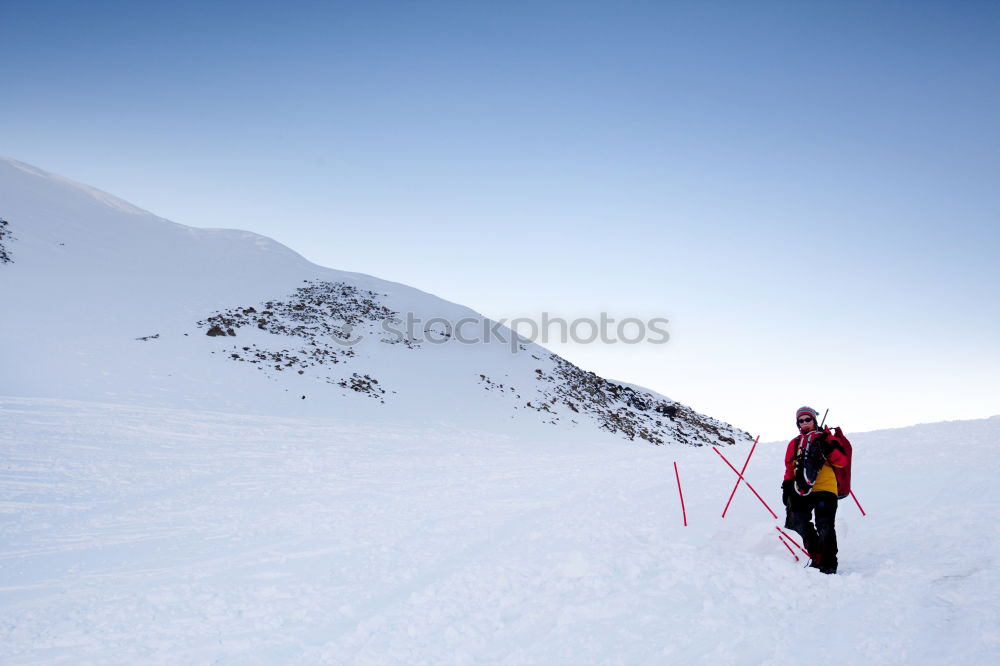 Similar – Skier in snowy landscape with hiking backpack