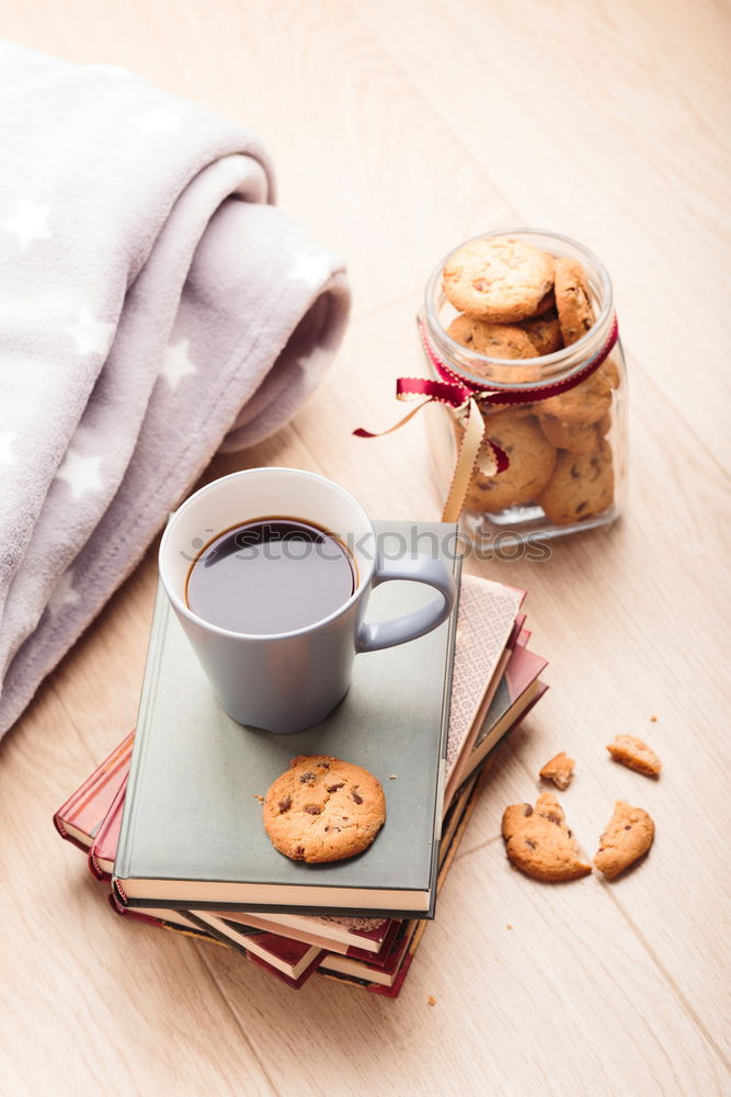 Similar – Image, Stock Photo A few books with cup of coffee and cookies on wooden floor