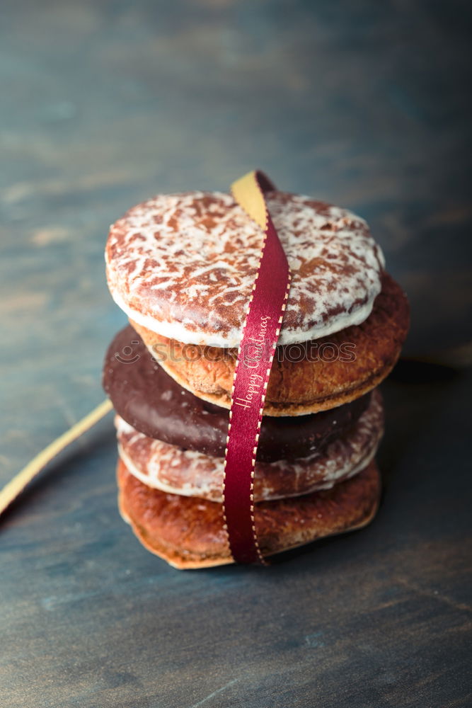 Similar – Image, Stock Photo A few gingerbread cookies wrapped in red ribbon Happy Christmas