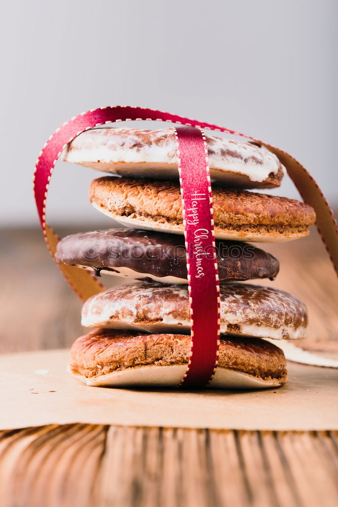 Image, Stock Photo A few gingerbread cookies wrapped in red ribbon Happy Christmas